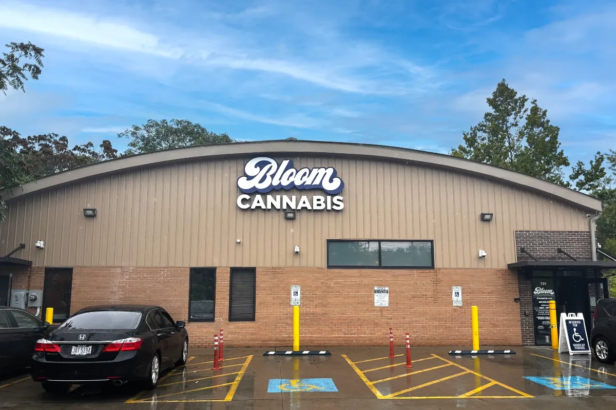 Exterior of the Bloom Cannabis dispensary in Akron, Ohio, with handicap parking spaces out front