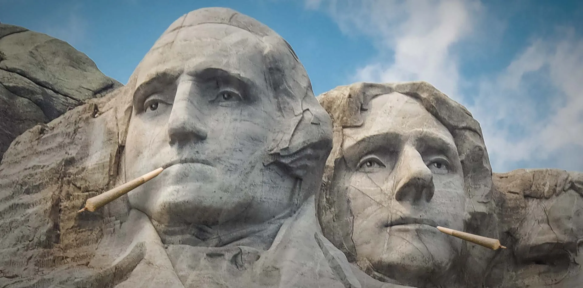 Mount Rushmore carvings of George Washington and Thomas Jefferson edited to show each smoking a joint