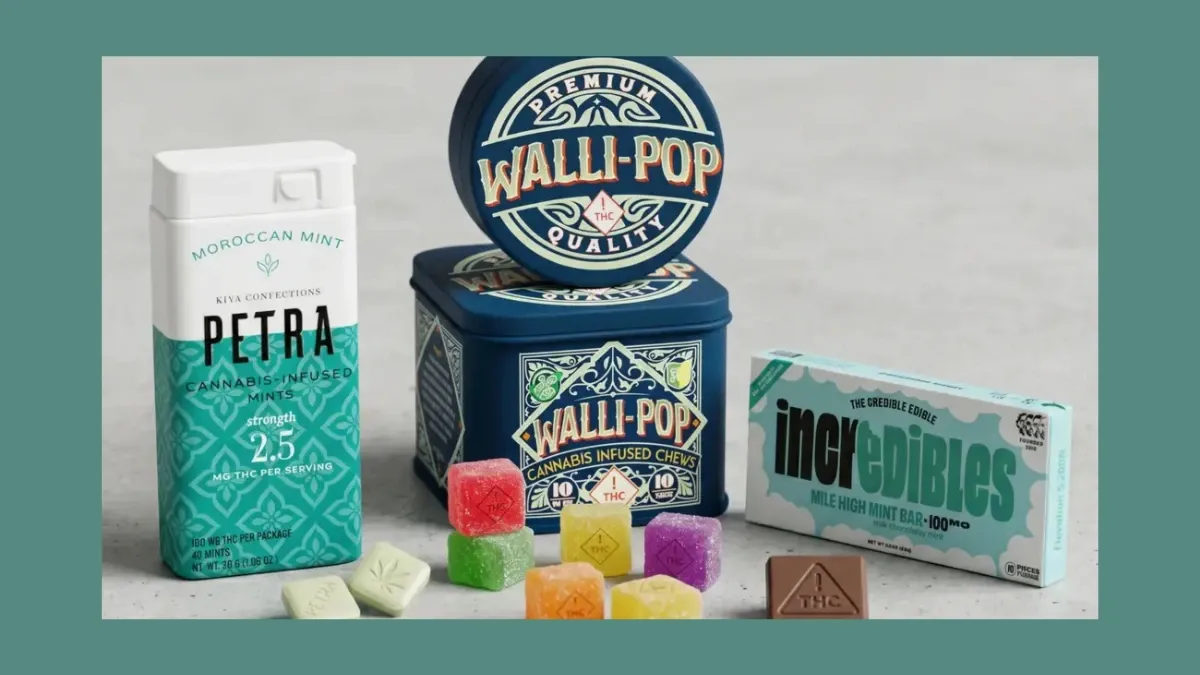 Assorted cannabis edibles including a pack of Petra mints, a tin of gummies, Incredibles chews and colorful gummy cubes