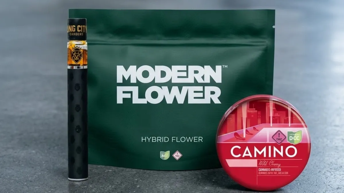 Sealed bag of Modern Flower hybrid flower, a capped vape pen and a tin of Camino gummies on a countertop