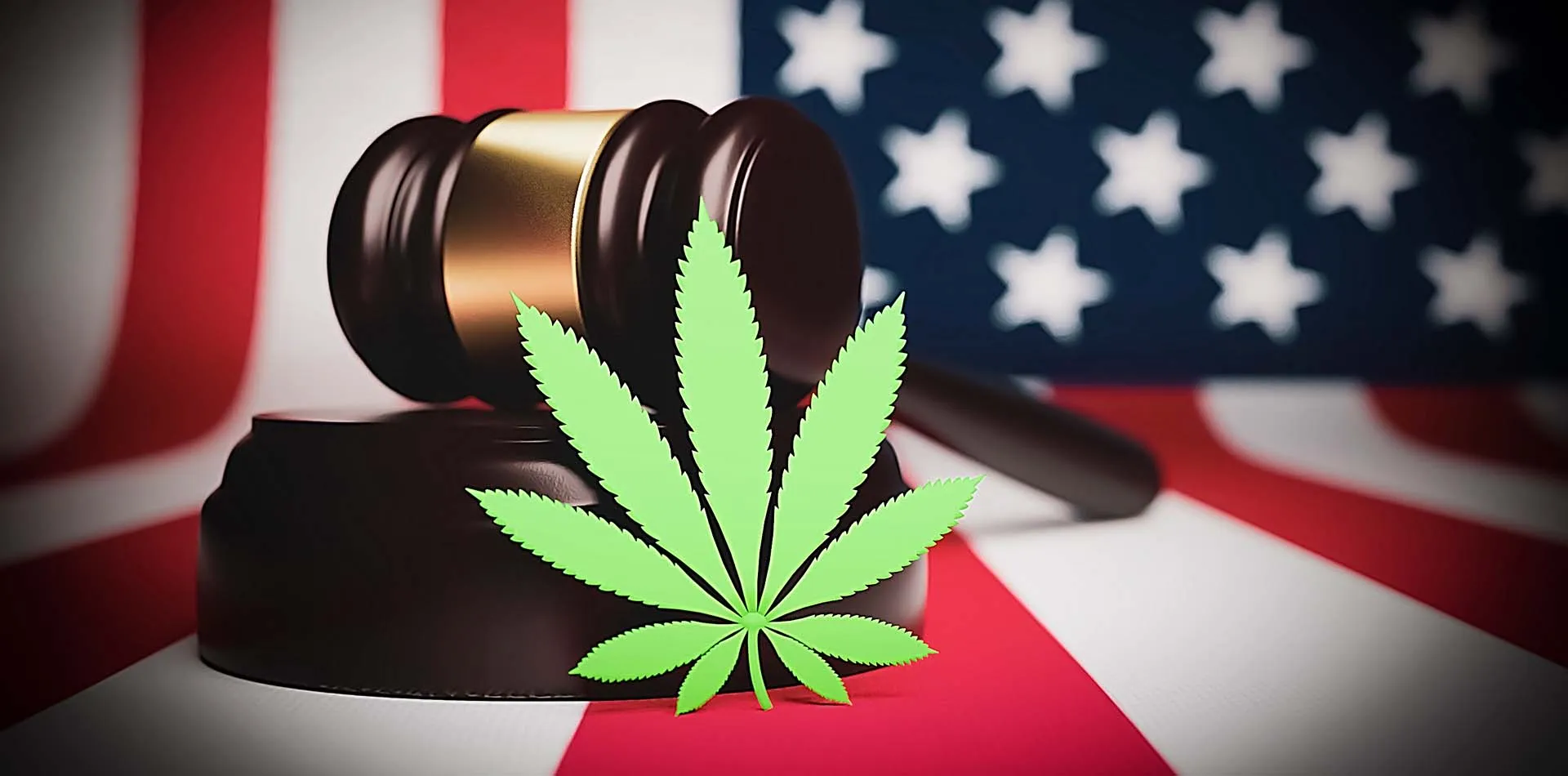 Cannabis leaf in front of a judge’s gavel with an American flag behind it