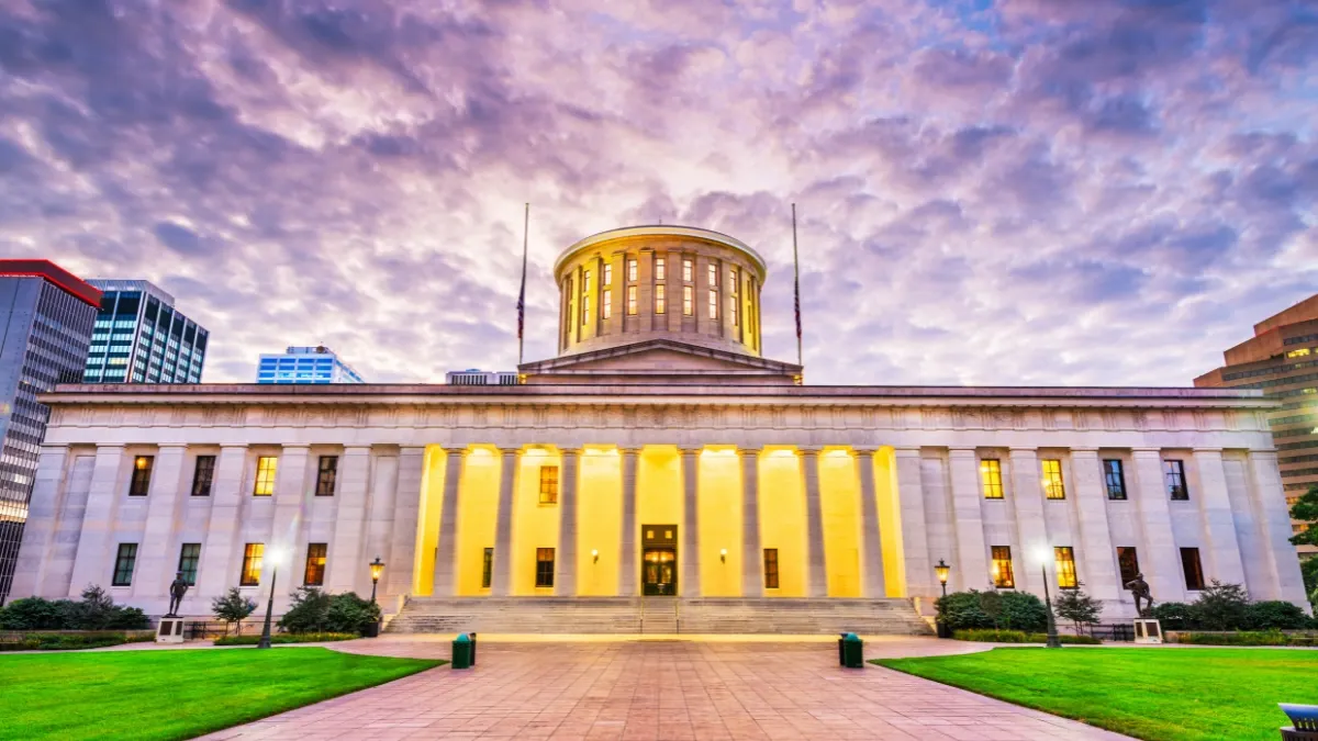 The Ohio Statehouse in Columbus at dusk, where Ohio's cannabis laws are written