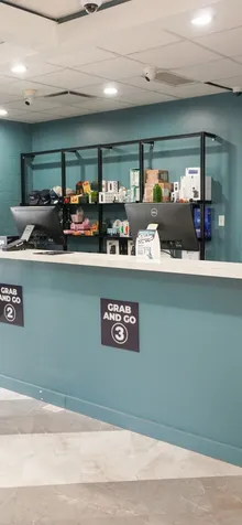 Grab and Go pickup counter with numbered pickup windows at the Bloom dispensary in Painesville, Ohio.
