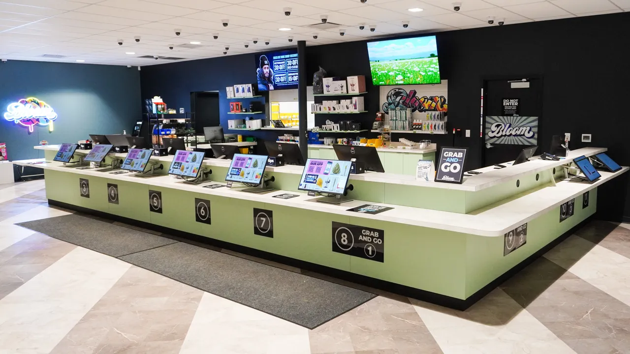 Sales counter with self-service menu kiosks inside the Bloom South Columbus dispensary in Columbus, Ohio.