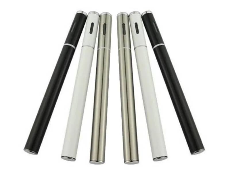 Six slim disposable cannabis vape pens in black, white and silver standing in a row