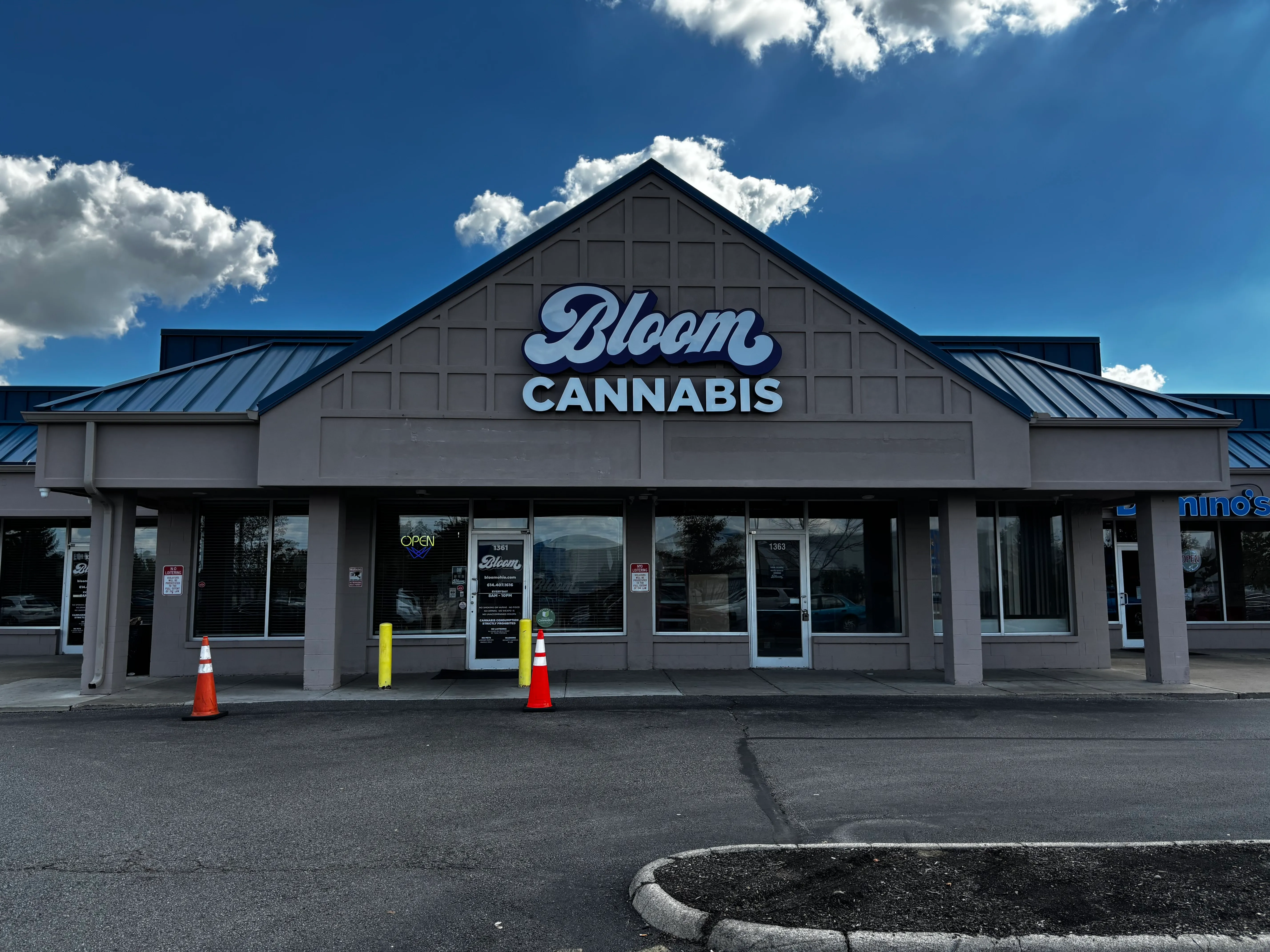 Bloom Cannabis dispensary storefront on Georgesville Road in West Columbus, Ohio, with the Bloom Cannabis sign above the entrance and parking out front.